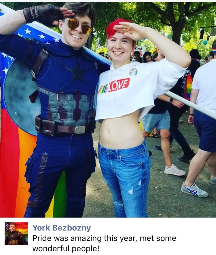 starcaptainyork:  nezumiko:  crewdlydrawn: mystrangedarkson:  nezumiko:  EPIC Photo from Portland Pride 2019 © The Oregonian [Photograph of a man dressed as Captain America, from behind with his shield on his back, waving a rainbow-striped American flag]