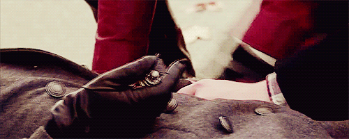 wistfulwatcher:  Regina reaching past her son to grasp Emma’s forearm. 