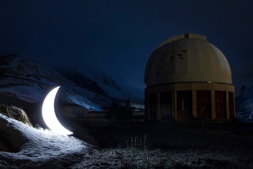 awkwardsituationist:for ten years now, leonid tishkov has traveled the world with his moon. here we see him in arctic sv