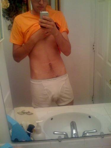 undie-fan-99:  Guy showing off in (what appears to be) his white Hanes boxerbriefs.