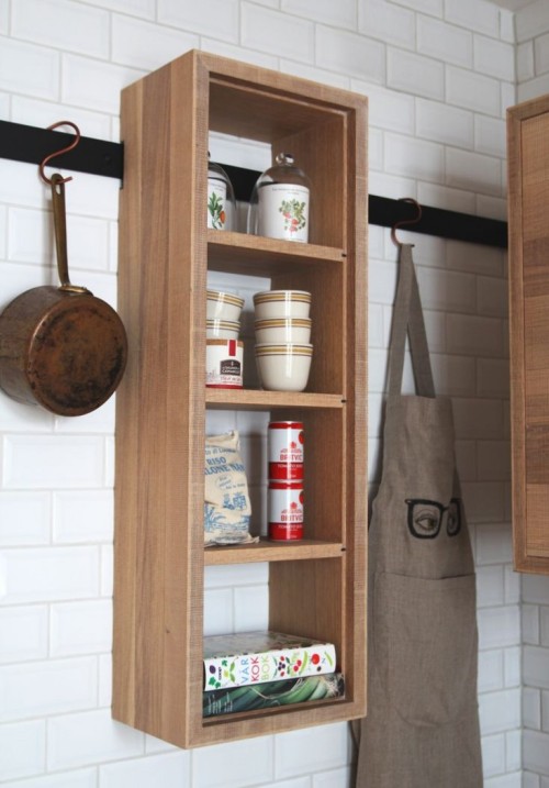 Railways modular cabinetry by Bucks and Spurs.Components hang on a wall-mounted rail. 