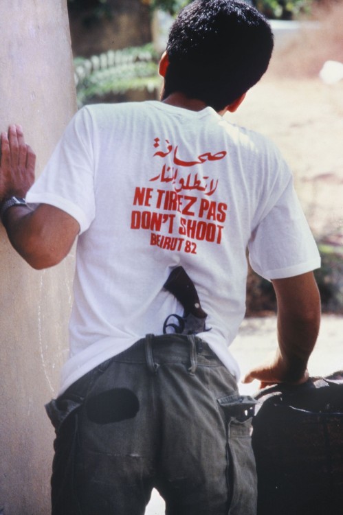 historicaltimes:A man with a gun and a ‘don’t shoot’ shirt. Siege of Beirut, 1982