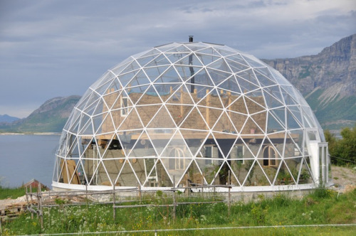 A gorgeous cob home wrapped in a geodesic dome.Source: Inhabitant