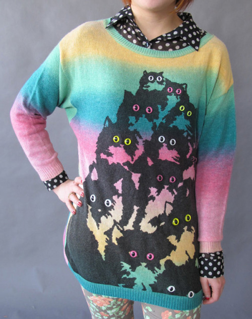 Joseph Aaron Segal’s , the Pretty Snake designer, oversized rainbow cat sweater is an interest