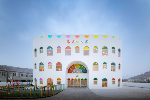 itscolossal:Hundreds of Rainbow Glass Panels Emit a Rotating Kaleidoscope in a Playful Kindergarten