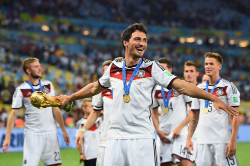 Soccer players. Sweaty, celebratory soccer players. With Julian Draxler (14) in the back, grabbing himself.