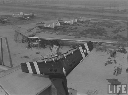 Edward Sharp poses with his model of a Flying Wing in front of the real thing(Bob Landry. 1947)