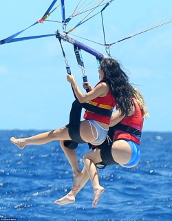 kardashianempires:  August 20, Kylie and Khloe parasailing in St.Barths. 
