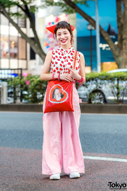 Japanese hair stylist Momoko on the street in Harajuku wearing a sleeveless strawberry print top fro