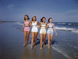 fuckyeahvintage-retro:  Four pals walk through the surf, 1949 © Getty Images 