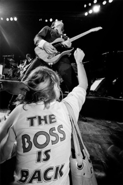 allaccessproject:  ALLACCESS-INSPIRATION / T-SHIRTSBRUCE SPRINGSTEEN PERFORMING WITH A FAN IN FOREGROUND WITH “THE BOSS IS BACK” SHIRT ON, 1978. PHOTO © LYNN GOLDSMITH