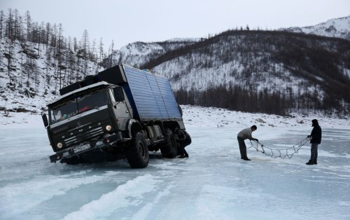 Amos Chapple was crammed alongside three Russians in a truck just big enough for two, trundling alon