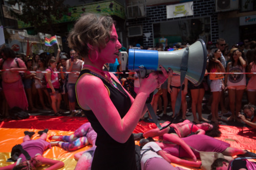 chubbygurl:  occupiedmuslim:  bidyke:  Today, on the Tel Aviv Pride Parade, our queer-anarchist activist group, Mashpritzot, protested against pinkwashing and the “gay” community’s priorities. The group painted themselves pink in protest against