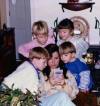 emily84:snuv:A mom helping her kids beat a hard level in Super Mario Land, 1990s.this
