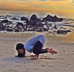 Angela Simmons doing yoga at the beach.