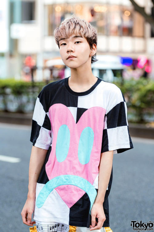 tokyo-fashion:  18-year-old Japanese student Nobuhiro on the street in Harajuku. He’s wearing a heart print top and sheet music print pants, both by Daniel Palillo, with Koji Kuga boots. Full Look