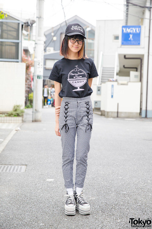 Miki on the street in Harajuku wearing a t-shirt and lace-up gingham pants from the Japanese brand C