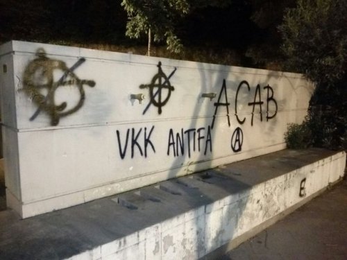 Antifascists fix up some nazi graffiti in Vallcarca, Barcelona