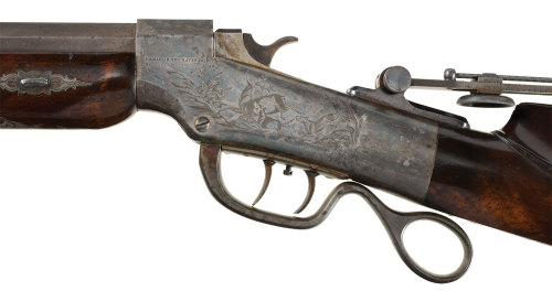 Exhibition quality Nimschke engraved Ballard single shot target rifle with silver mounted stock.