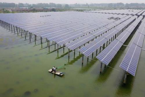 solarpunks: People fish for crayfish next to solar panels at a fishery-solar hybrid photovoltaic pow
