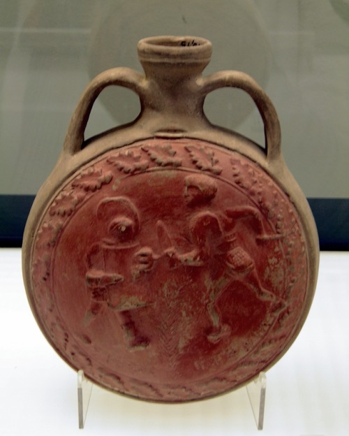 Ancient Roman terracotta flask depicting gladiatorial combat.  Now in the Romisch-Germanisches Museu