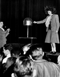 Static electricity makes a Stamford schoolgirl&rsquo;s hair stand on end, 1948.