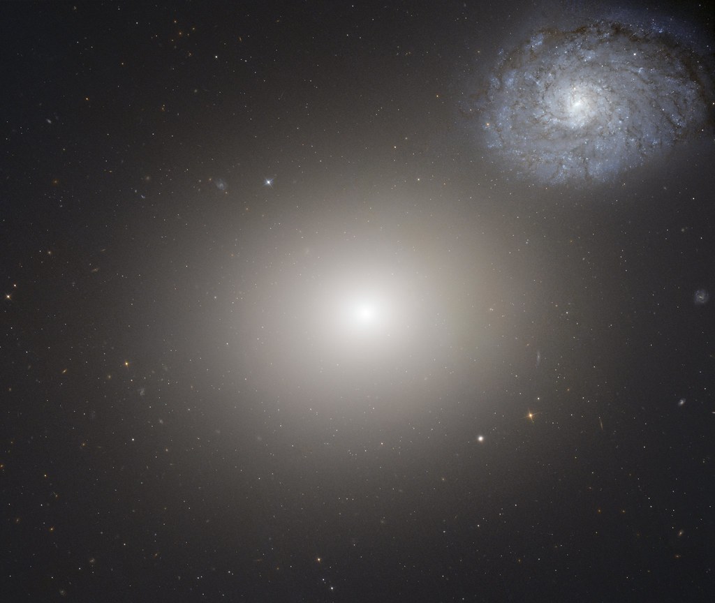 Arp 116: Odd Galaxy Couple on Space Voyage by NASA Hubble