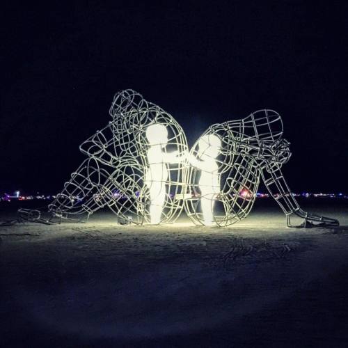 Burning Man 2015 – Two adults back to back