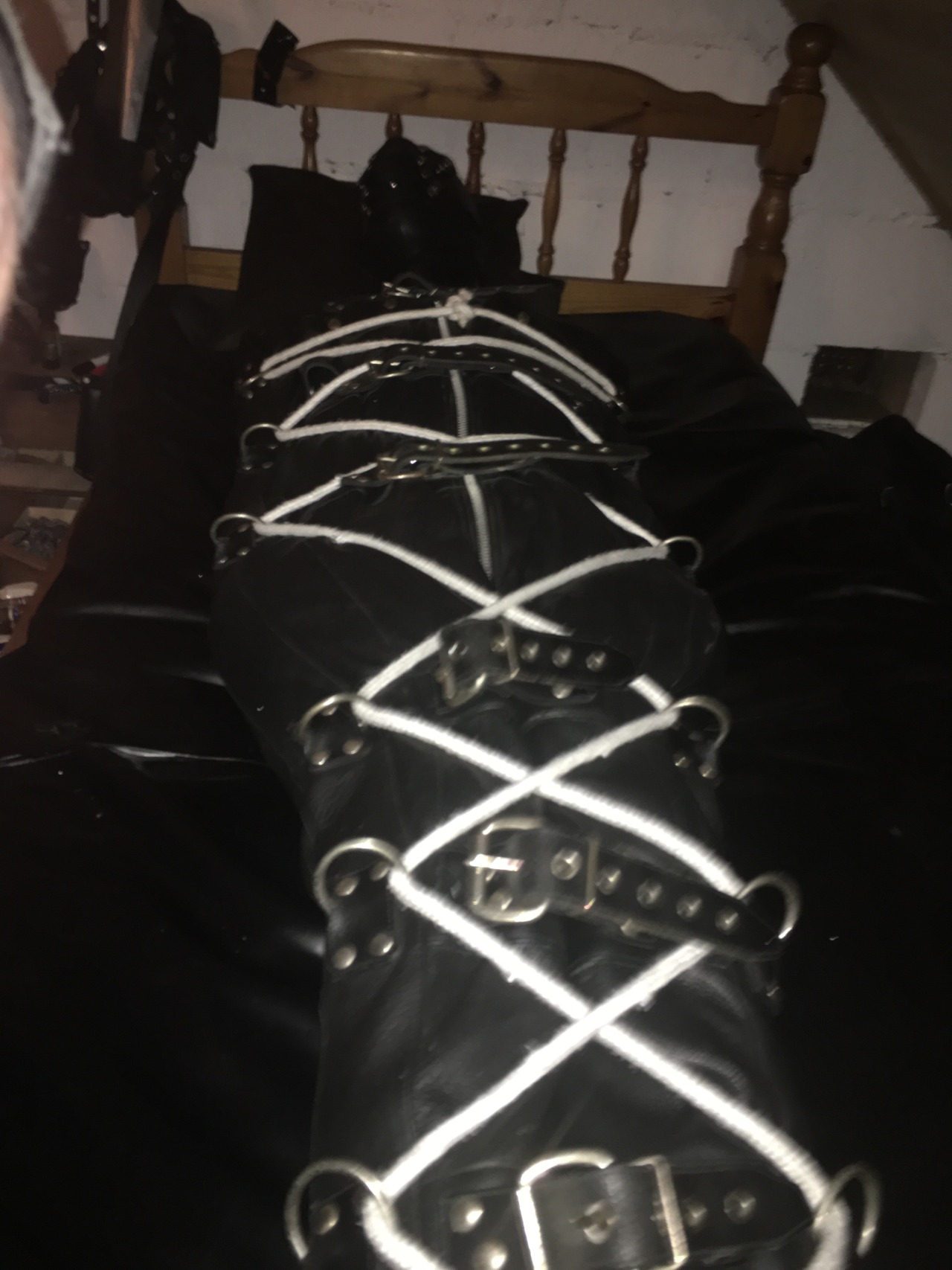 jamesbondagesx: Intruder in uniform and secured in sleep sack, tied to post and milked