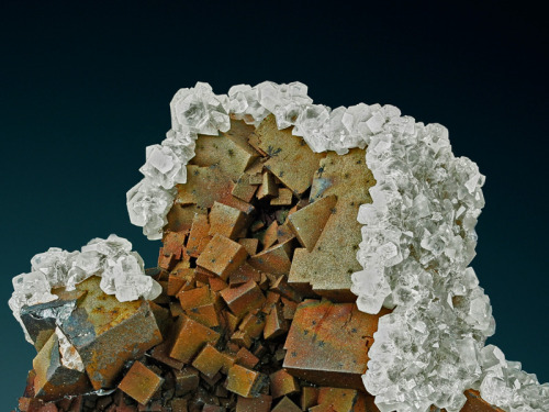 Fluorite and Kanonenspat Calcite - NamibiaThe Fluorite is covered by a layer of Manganese (underneat