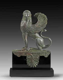 archaicwonder:  Greek Bronze Sphinx Figurine, Late Archaic, 5th Century BCThe sphinx was a female monster with the body of a lion, the breast and head of a woman, eagle’s wings and, according to some, a serpent-headed tail. She was sent by the gods