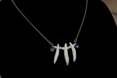 Coyote teeth, mother of pearl and opalesque resin drop bead necklace. Available with either silver o