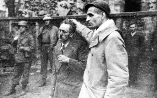 iammyfather:  tikkunolamorgtfo:  rabinovvitz:  ofskfe:  A survivor drags a former concentration camp guard by the hair while American troops look on at the newly liberated Dora-Mittelbau concentration camp, April 1945.  Why do we never see these photos,