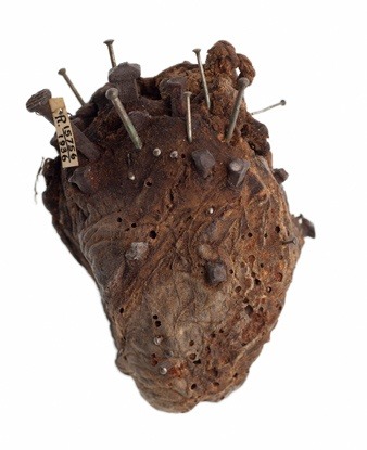 One crazy looking amulet; a sheep&rsquo;s heart, stuck with nails and pins. It