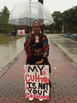 jerickstightasshole: I just saw this beautiful girl on my walk to class! I love her message and that she is willing to stand in the rain for what she believes in. #stopculturalappropriation 