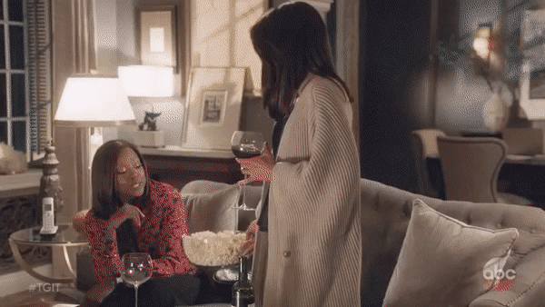 olivia pope and annalise keating drinking wine and eating popcorn ...