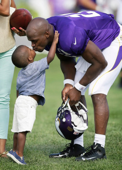 -Moment Of Silence-  Note: This Photo Shows Adrian With His Son, Adrian Jr. Not His