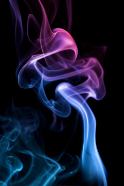 sergeymihali:   	Dancing Smoke by Nick McCarthy    	Via Flickr: 	Smoke caught in action, burnning incense and using two flashes.  Strobist: 2x-Vivitar 285HV’s Both very close, one red gelled, the other blue.  The key is to get the light behind the smoke