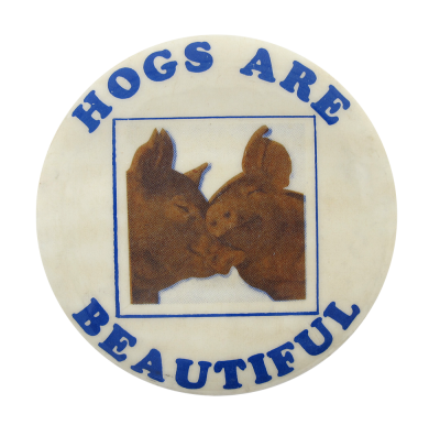 a white pin with blue text that reads 'HOGS ARE BEAUTIFUL'. in the center there are two hogs embracing each other within a blue square