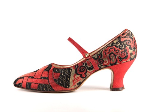 Black and red brocade shoes, decorated with red interwoven stripes and curls.Great Britain1920sShoe-