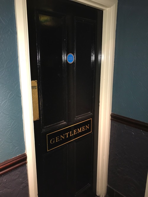 Cool mensroom at a typical English pub near Tower Bridge in London