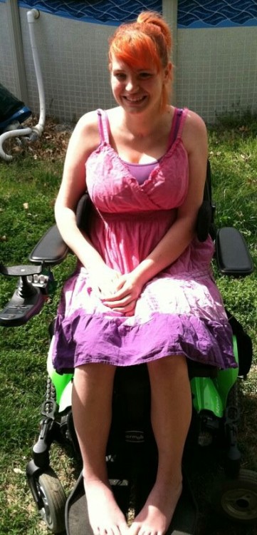 her electric wheelchair