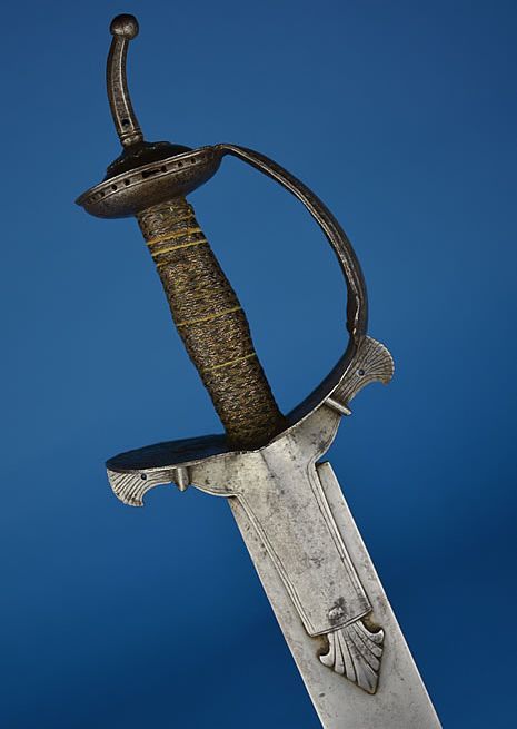 art-of-swords:  Khanda Sword Dated: 19th century Culture: probably Deccan Place of Origin: India Measurements: overall length: 37 inches (940mm); blade length: 30 inches (760mm) The hilt is of Indian ‘basket’ form features a short faceted pommel spike,