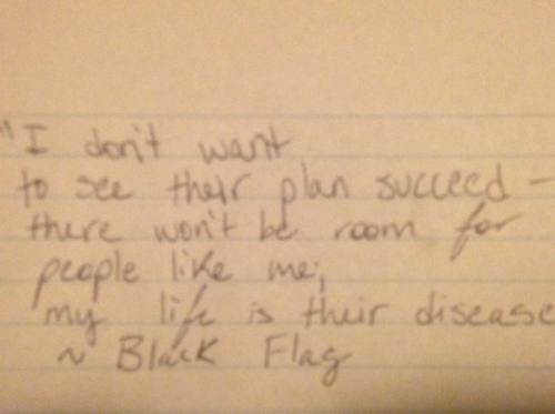 Image: Hand written lyrics from a Black Flag song on a piece of lined paper:Text: &ldquo;I don&a