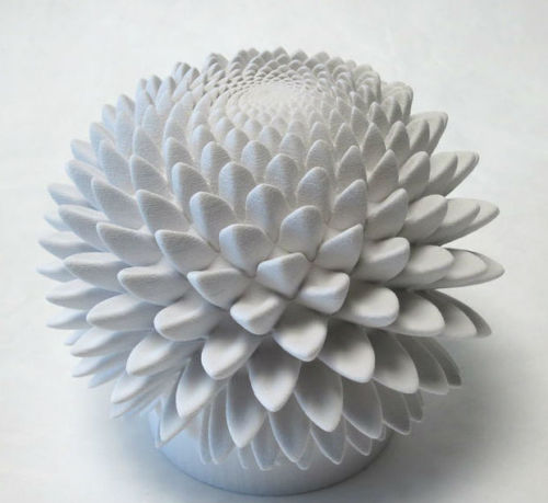 geometrymatters:  “ What you are viewing in each of the above videos is a solid 3D printed sculpture spinning at 550 RPMs while being videotaped at 24 frames-per-second with a very fast shutter speed (1/2000 sec). The rotation speed is carefully synchroni