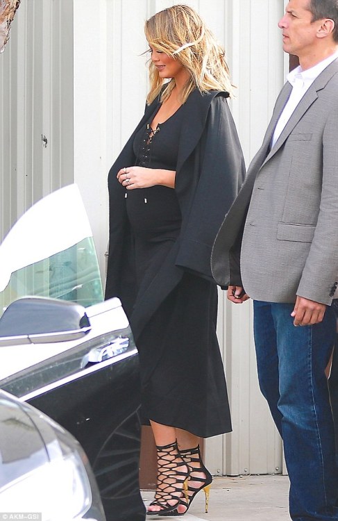 Chrissy Teigen stuns in form-fitting dress as she and husband John Legend leave Khloe Kardashian&