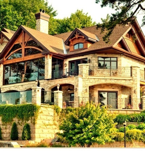 Craftsman ExteriorAn Expansive Beige, Three-story, Mixed-siding, Gable-roof Arts And Crafts Design Example