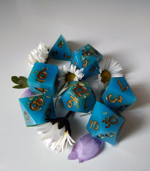 juspeczik:My first set of dice Handmade! Opaque cyan with gold leaf mixed with resin. Golden numbers