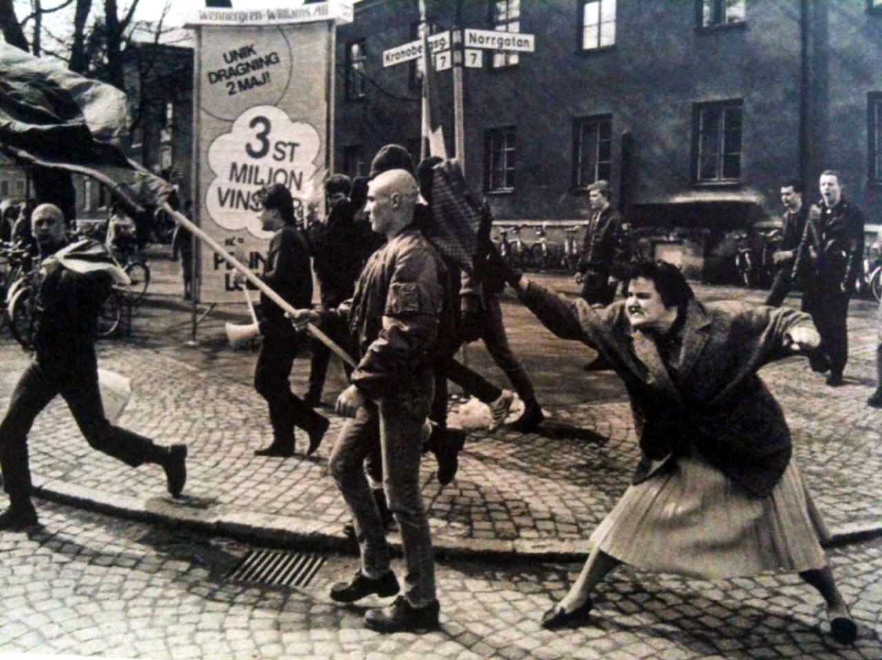 A Swedish woman hitting a neo-Nazi protester with her handbag. The woman was reportedly