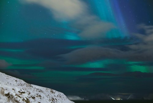 Northern lights over the Arctic town of Hammerfest. Photographed by Reuben Wu.